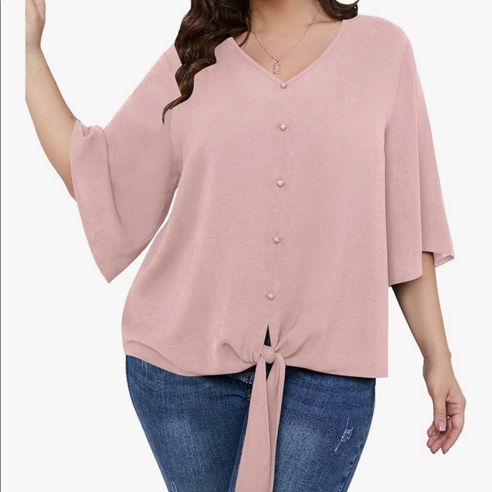 Peach-colored blouse with flutter sleeves